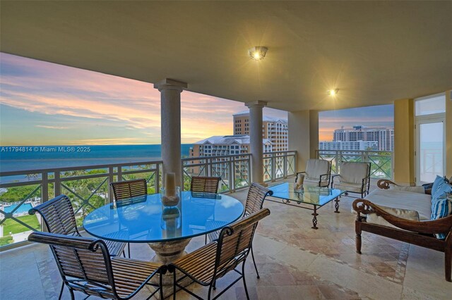 445 Grand Bay Dr Unit 1001, Key Biscayne, FL 33149 - balcony featuring a water view and outdoor dining space