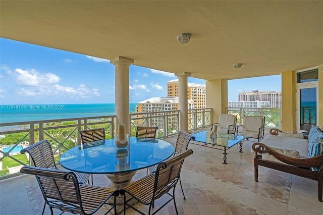 445 Grand Bay Dr Unit 1001, Key Biscayne, FL 33149 - balcony featuring a water view and outdoor dining area