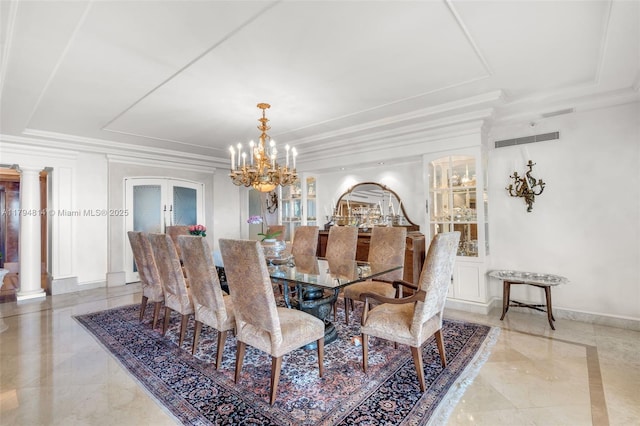 445 Grand Bay Dr Unit 1001, Key Biscayne, FL 33149 - dining area featuring a raised ceiling, a chandelier, baseboards, light marble finish flooring, and ornate columns