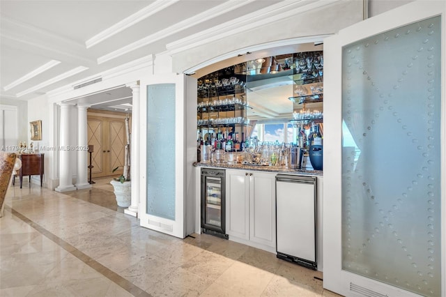445 Grand Bay Dr Unit 1001, Key Biscayne, FL 33149 - indoor wet bar with beverage cooler, decorative columns, fridge, ornamental molding, and inlaid floor details
