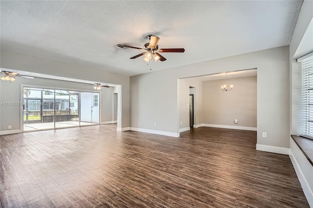 4380 NW 4th Ct, Coconut Creek, FL 33066 - unfurnished living room featuring dark wood-style flooring, baseboards, ceiling fan with notable chandelier, and a textured ceiling