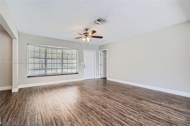 4380 NW 4th Ct, Coconut Creek, FL 33066 - unfurnished living room with dark wood-style flooring, baseboards, visible vents, and ceiling fan