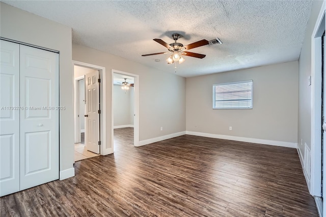 4380 NW 4th Ct, Coconut Creek, FL 33066 - unfurnished bedroom with a textured ceiling, baseboards, wood finished floors, visible vents, and a closet