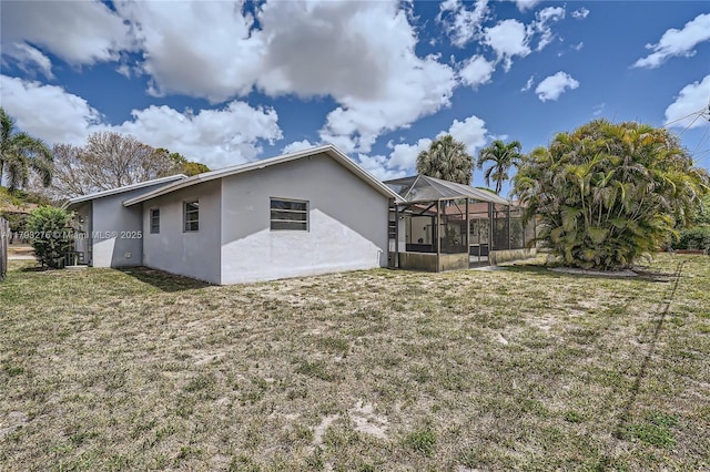 4380 NW 4th Ct, Coconut Creek, FL 33066 - rear view of property with a lanai, stucco siding, and a yard