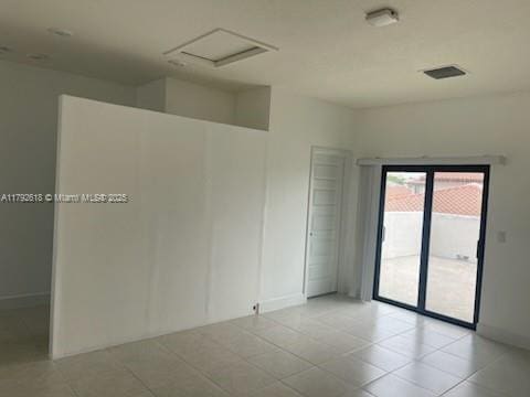 4755 NW 83rd Path, Doral, FL 33166 - tiled empty room with baseboards and visible vents