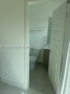 4755 NW 83rd Path, Doral, FL 33166 - bathroom featuring tile patterned flooring and toilet