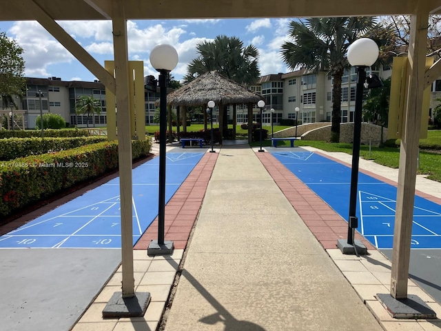 surrounding community featuring shuffleboard and a gazebo