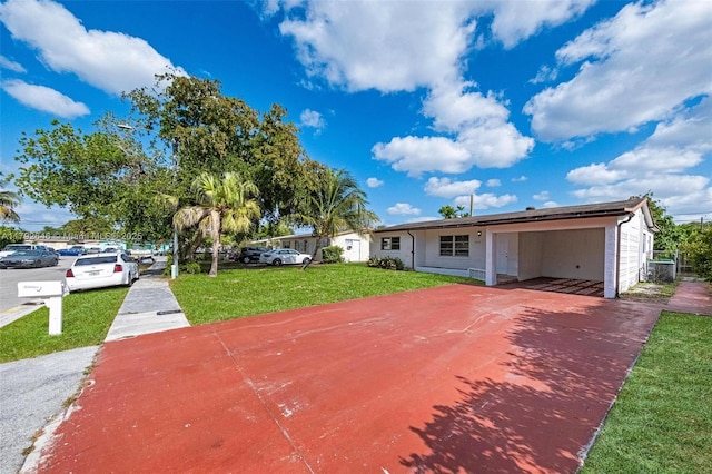 6808 SW 22nd Ct, Miramar, FL 33023 - view of front of home featuring driveway, a front lawn, and a carport