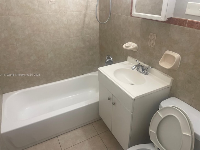 full bathroom featuring vanity, toilet, tile patterned floors, tile walls, and shower / bathing tub combination