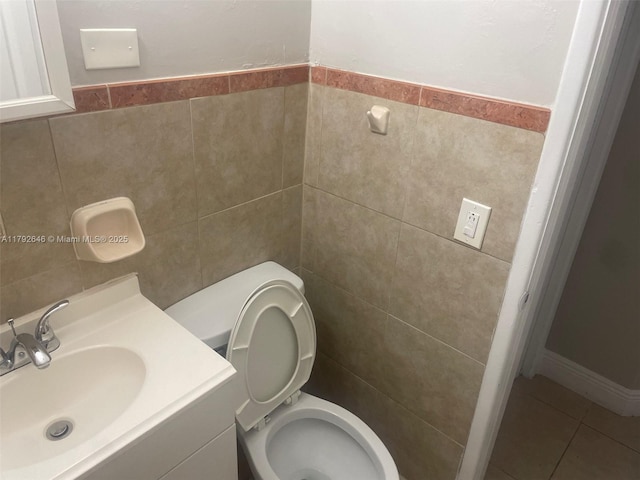 bathroom featuring tile walls, tile patterned floors, vanity, and toilet