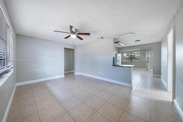 6808 SW 22nd Ct, Miramar, FL 33023 - spare room with light tile patterned flooring, ceiling fan, and baseboards