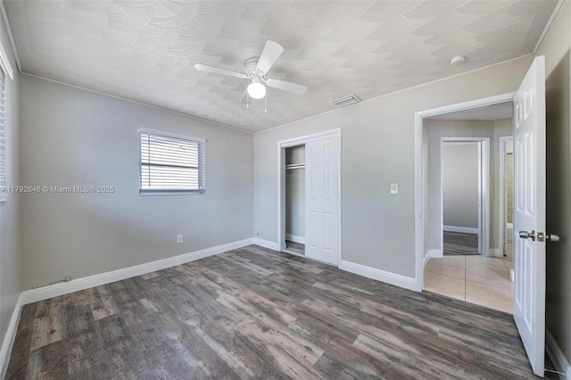 6808 SW 22nd Ct, Miramar, FL 33023 - unfurnished bedroom with wood finished floors, baseboards, a closet, a ceiling fan, and crown molding