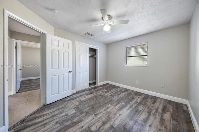 6808 SW 22nd Ct, Miramar, FL 33023 - unfurnished bedroom featuring baseboards, wood finished floors, a closet, and a ceiling fan