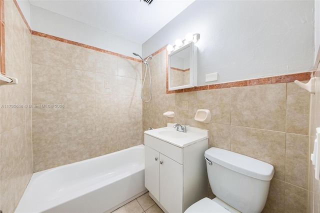 6808 SW 22nd Ct, Miramar, FL 33023 - bathroom featuring tile walls, toilet,  shower combination, vanity, and wainscoting