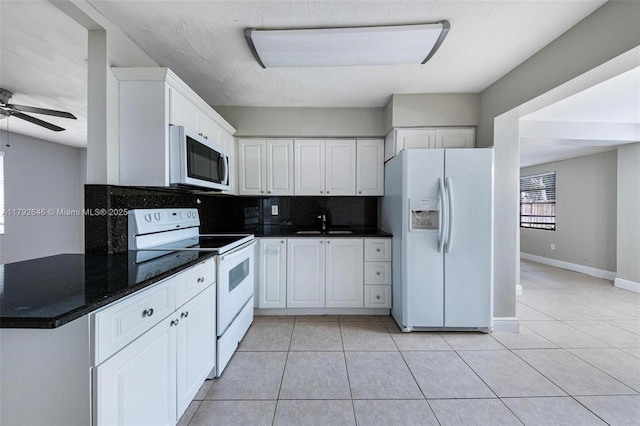 6808 SW 22nd Ct, Miramar, FL 33023 - kitchen with white appliances, a sink, light tile patterned floors, and backsplash