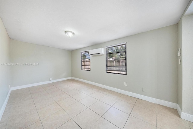 6808 SW 22nd Ct, Miramar, FL 33023 - empty room with an AC wall unit, light tile patterned flooring, and baseboards