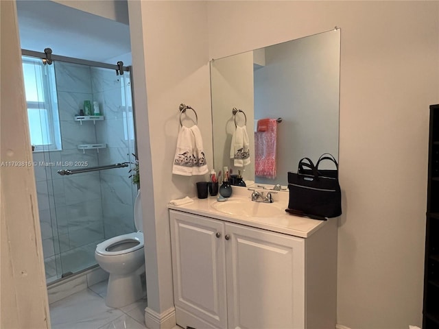 bathroom with vanity, a stall shower, toilet, and marble finish floor