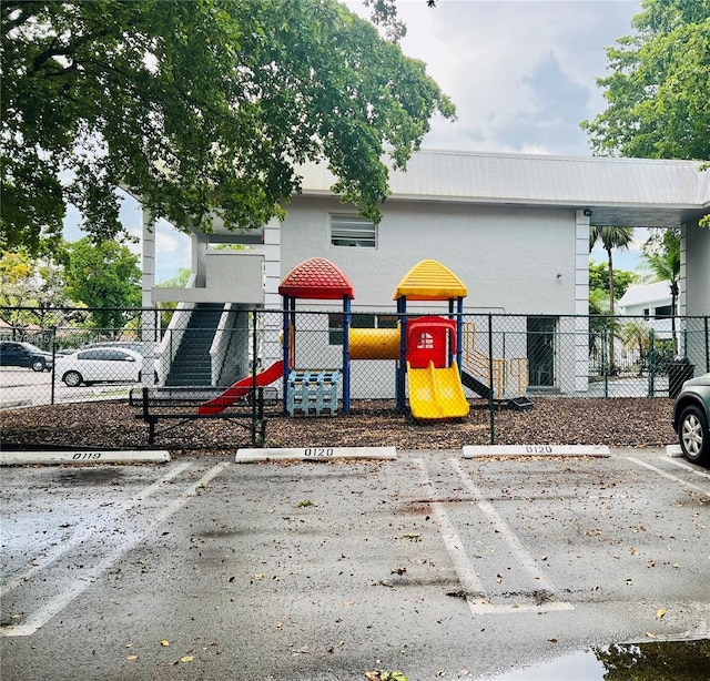 community jungle gym featuring fence