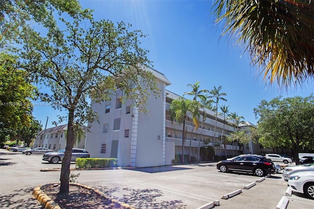 17255 SW 95th Ave Unit 247, Palmetto Bay, FL 33157 - view of building exterior with uncovered parking