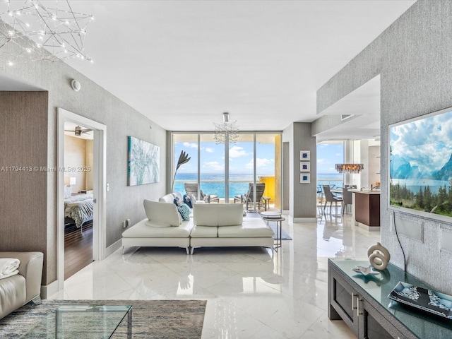 17875 Collins Ave Unit 1605, Sunny Isles Beach, FL 33160 - living area featuring a chandelier, a textured wall, and a wall of windows