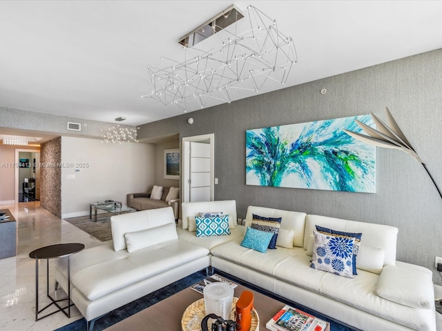 living room with wallpapered walls and visible vents