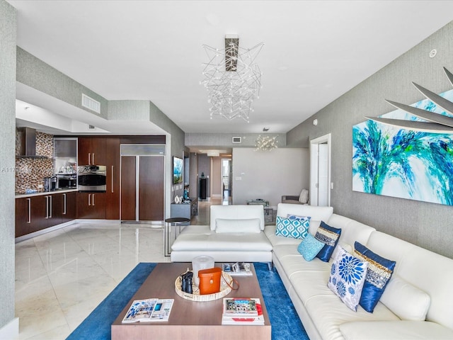 living room featuring an inviting chandelier, marble finish floor, and visible vents