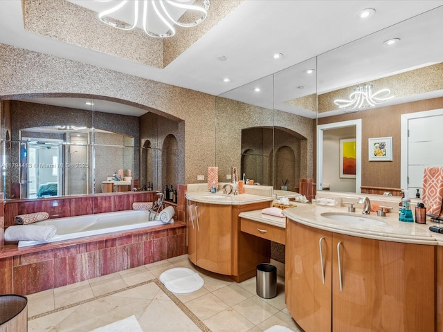 bathroom with a sink, tile patterned flooring, a chandelier, two vanities, and a shower stall