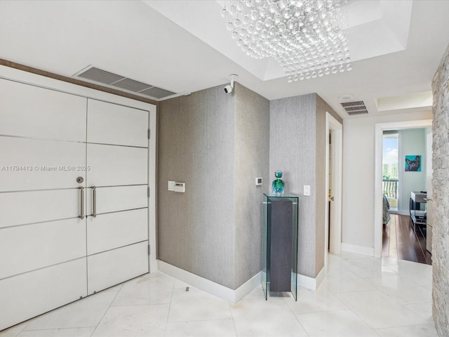 17875 Collins Ave Unit 1605, Sunny Isles Beach, FL 33160 - corridor featuring a tray ceiling and baseboards