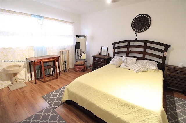 bedroom featuring wood finished floors