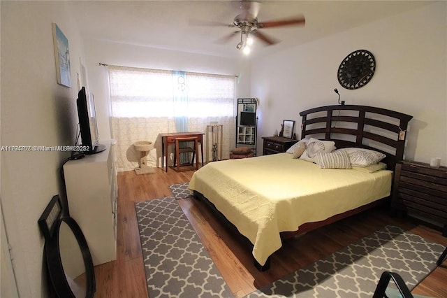 bedroom with ceiling fan and wood finished floors