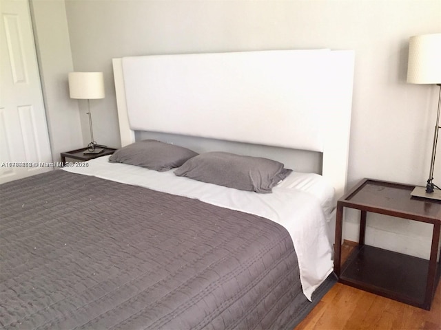 bedroom featuring wood finished floors