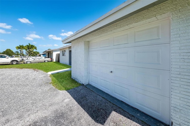 6620 NW 21st Ct, Sunrise, FL 33313 - garage featuring aphalt driveway