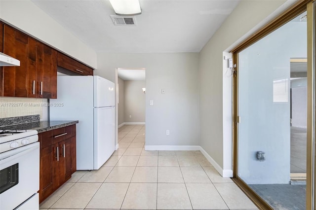 6620 NW 21st Ct, Sunrise, FL 33313 - kitchen featuring visible vents, white appliances, baseboards, tasteful backsplash, and light tile patterned floors