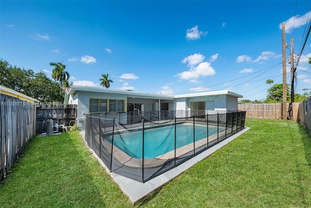 6620 NW 21st Ct, Sunrise, FL 33313 - view of pool with a yard, a fenced in pool, and a fenced backyard