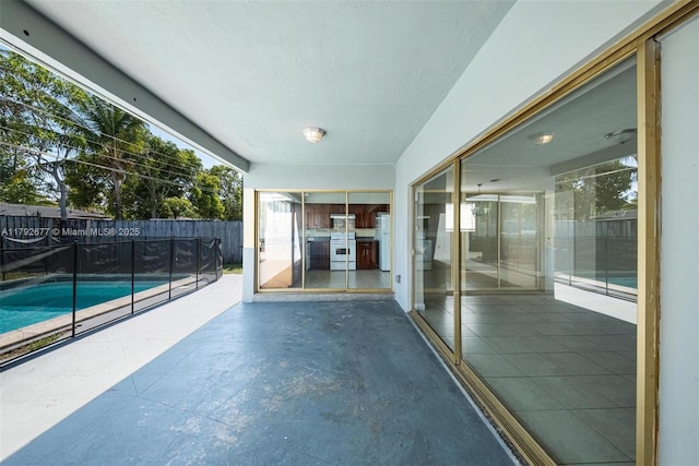 6620 NW 21st Ct, Sunrise, FL 33313 - view of patio / terrace with a fenced in pool and a fenced backyard