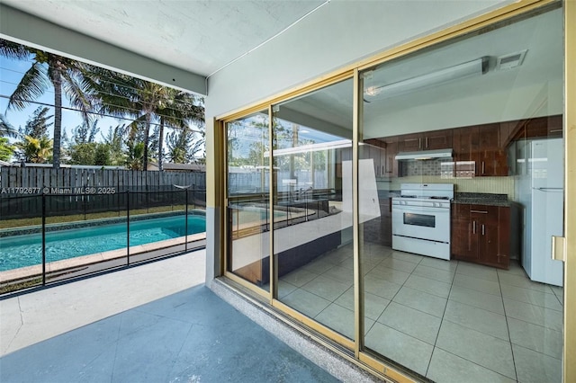 6620 NW 21st Ct, Sunrise, FL 33313 - exterior space with a fenced in pool, a fenced backyard, a patio, and area for grilling