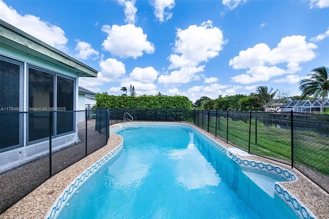 view of pool with a fenced in pool, a fenced backyard, and a yard