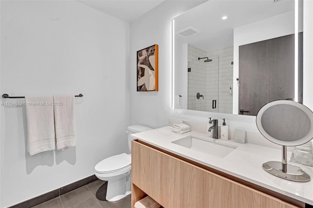 full bath featuring visible vents, a shower stall, vanity, tile patterned floors, and toilet