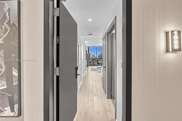 corridor with light wood-style flooring