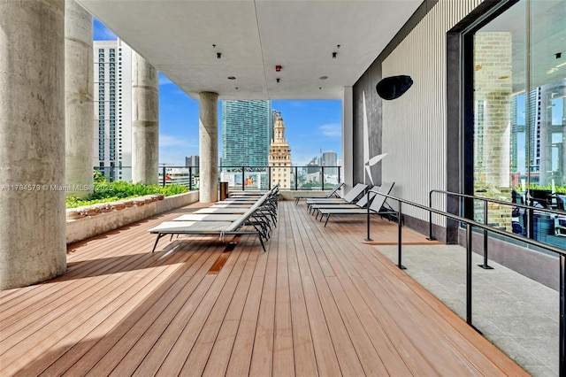 wooden deck with a view of city