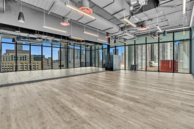 interior space featuring a view of city and wood finished floors