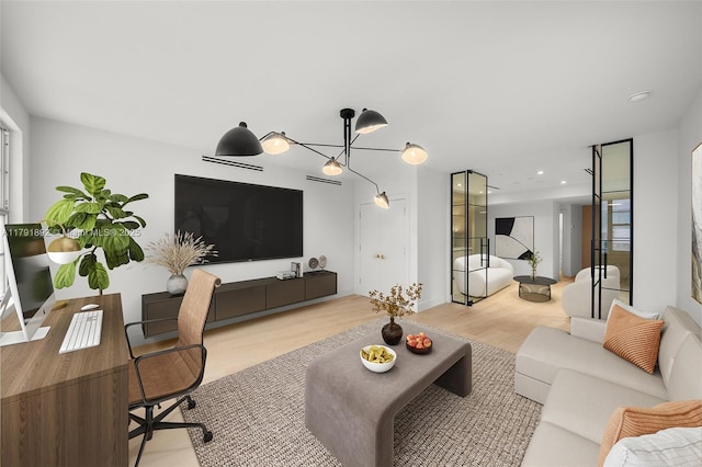 living area with recessed lighting and wood finished floors