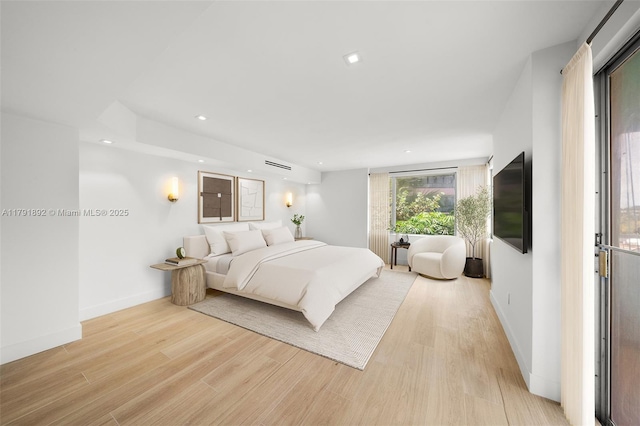 bedroom with recessed lighting, baseboards, light wood-type flooring, and visible vents