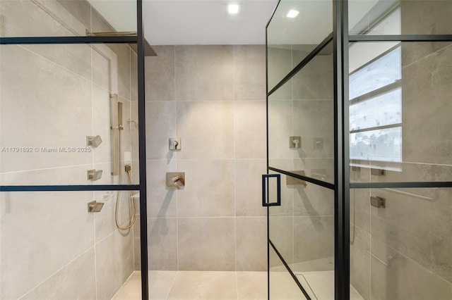 bathroom featuring a stall shower and recessed lighting