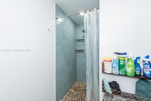 bathroom with tiled shower