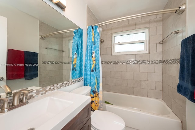 bathroom with toilet, shower / bath combo, and vanity