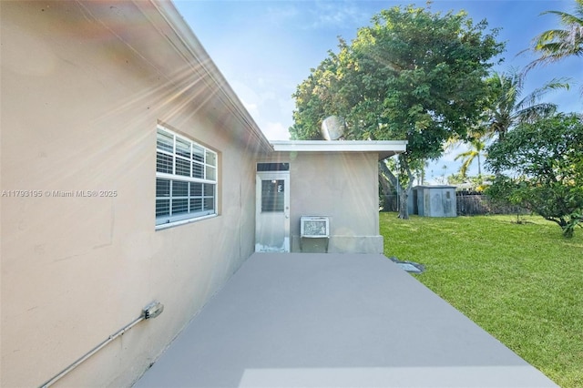 6421 NW 24th Pl, Sunrise, FL 33313 - view of patio with a storage shed, fence, and an outbuilding