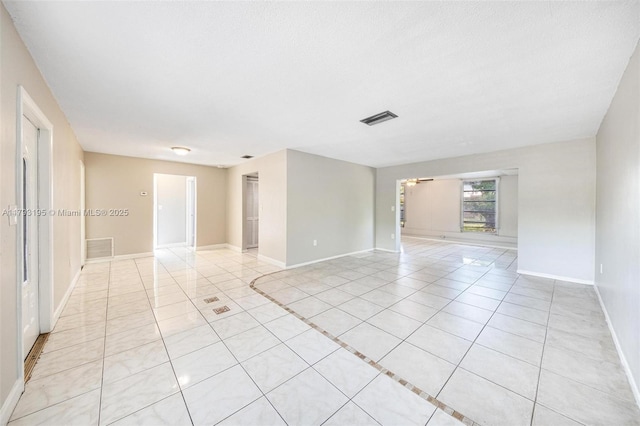 6421 NW 24th Pl, Sunrise, FL 33313 - empty room with visible vents, baseboards, and light tile patterned floors