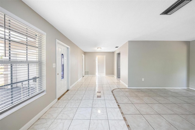 6421 NW 24th Pl, Sunrise, FL 33313 - unfurnished room featuring baseboards, a textured ceiling, light tile patterned flooring, and visible vents