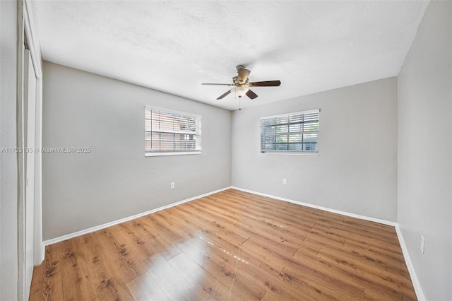 6421 NW 24th Pl, Sunrise, FL 33313 - unfurnished room with ceiling fan, baseboards, and wood finished floors
